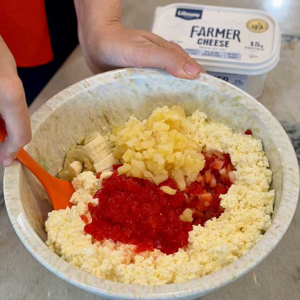 Mixing in all the ingredients.