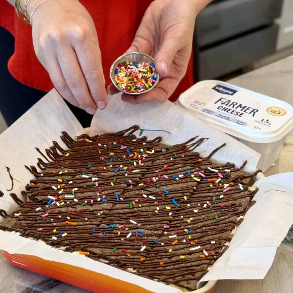 Decorating the ice cream sandwiches.