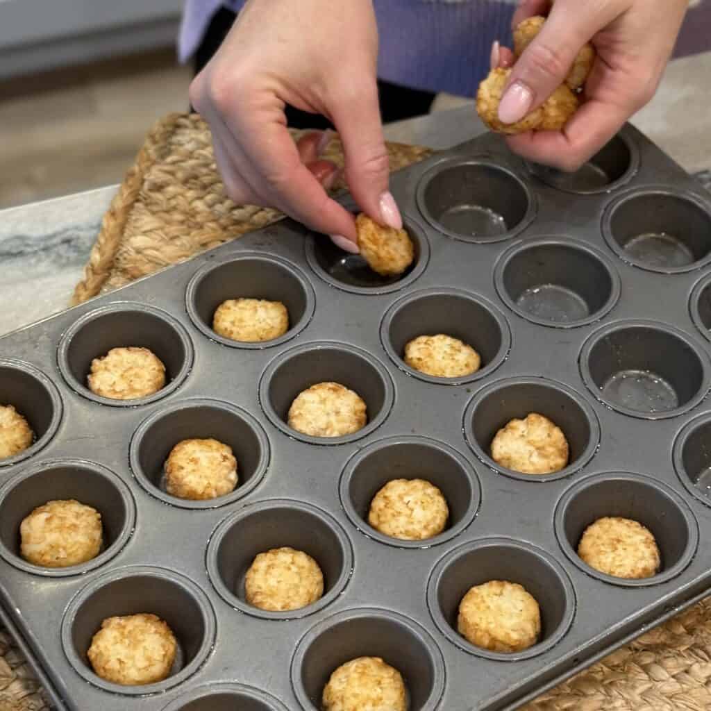 Adding Hash brown individuals to the pan.
