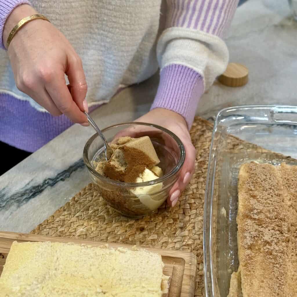 mixing butter and cinnamon together.