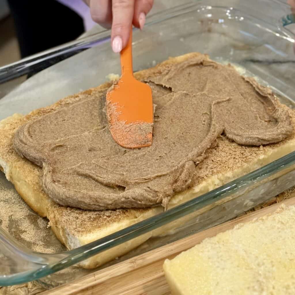 Spreading the mixture for the sliders.