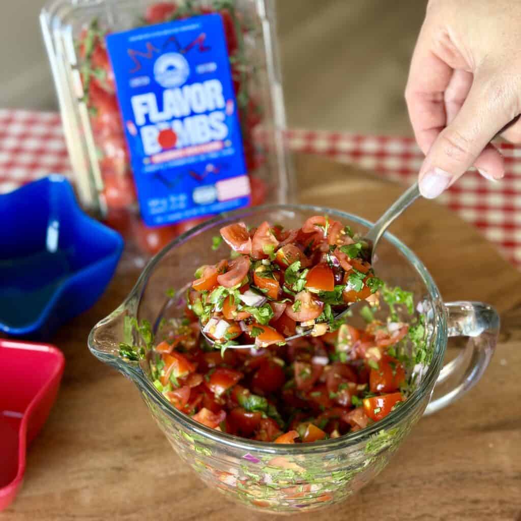 A spoon of tomato salad.