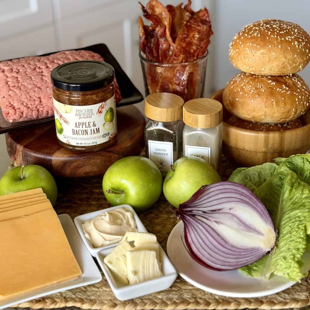 The ingredients to make an apple bacon smash burger.