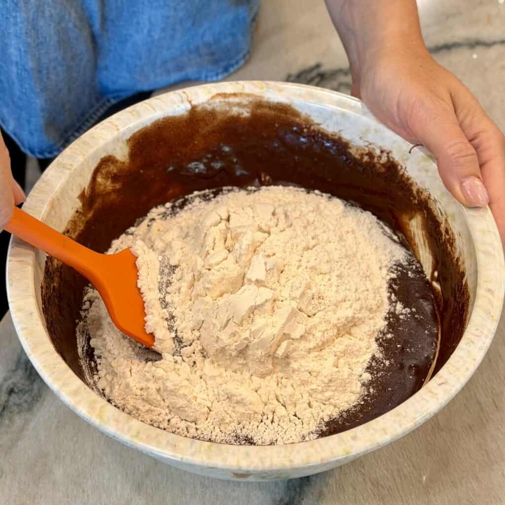 Adding flour to the pan.