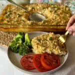 A plate of rice o roni casserole with sides.