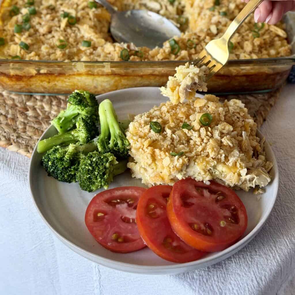 A plate of rice o roni casserole with sides.