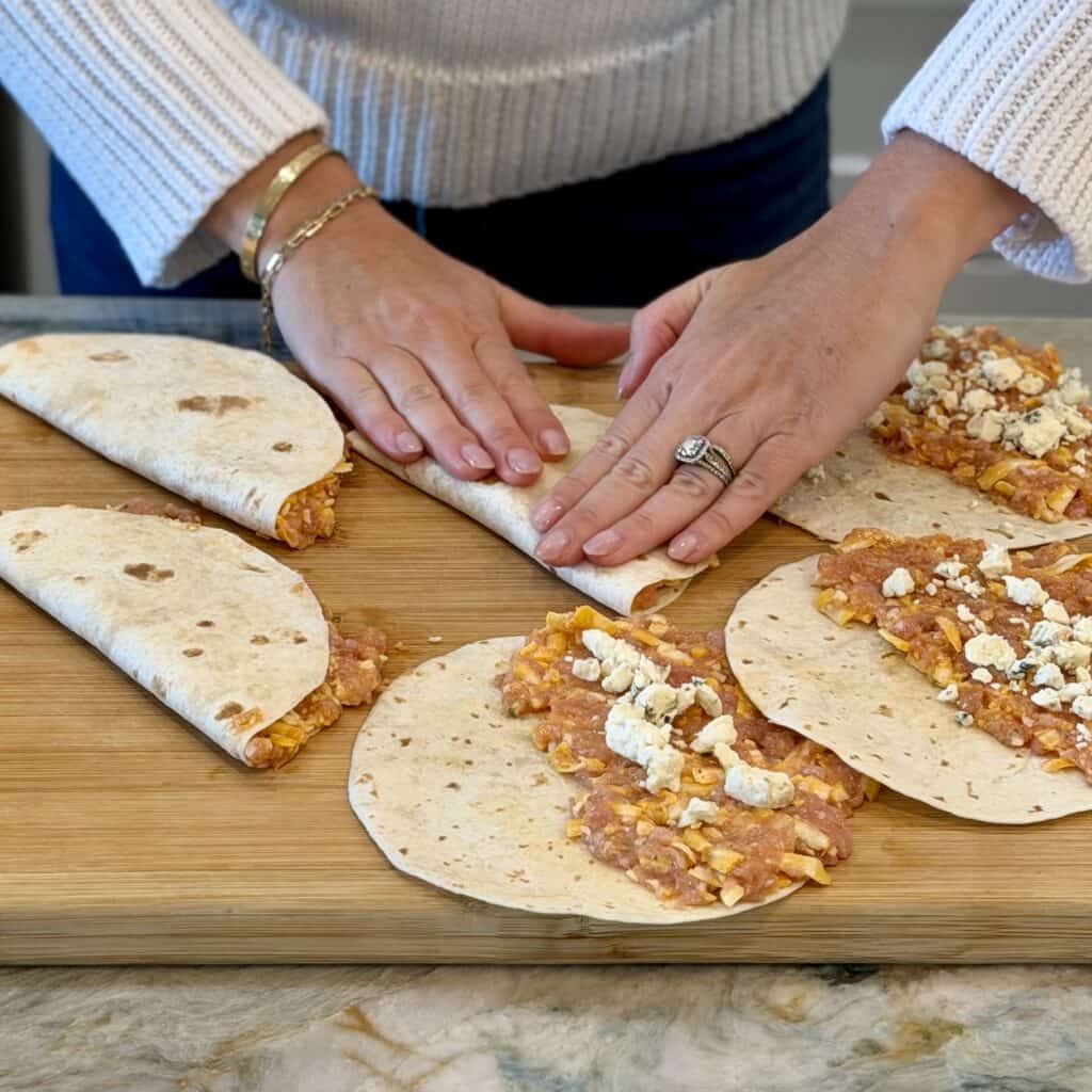 Folding the tacos.