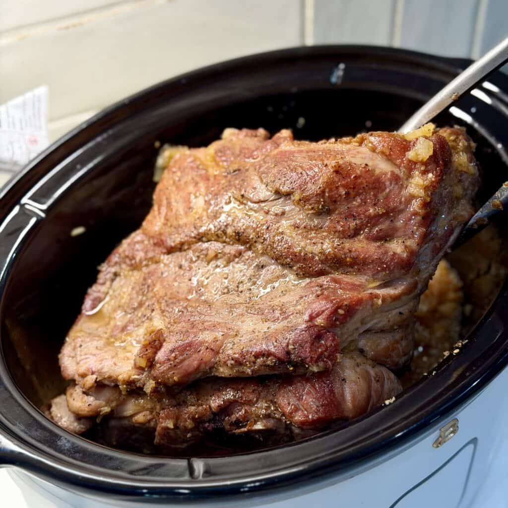 Flipping the roast in the pan.