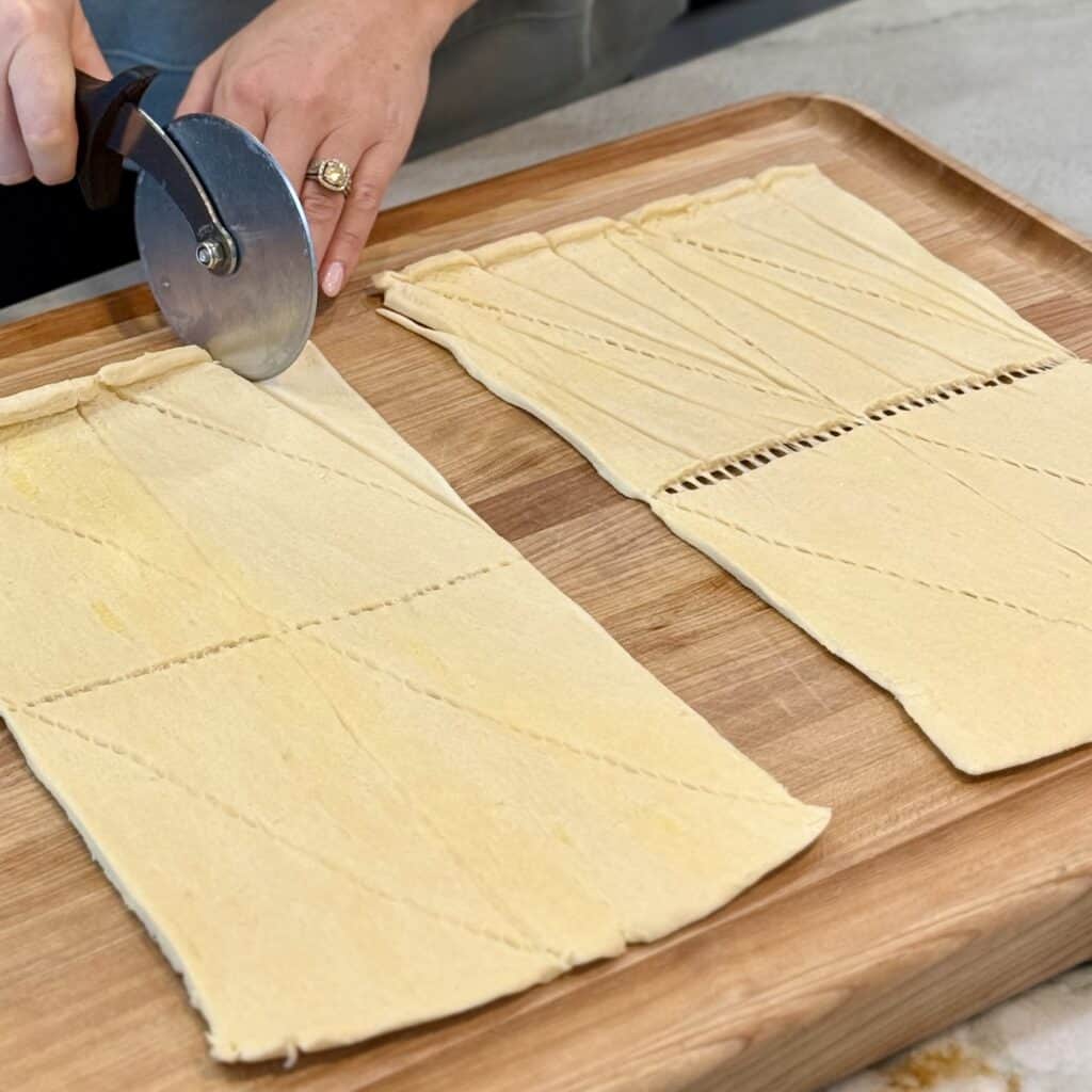 Slicing the croissant dough.