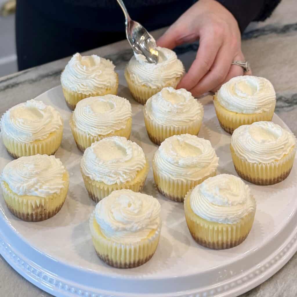 Decorating the cheese cake bites.