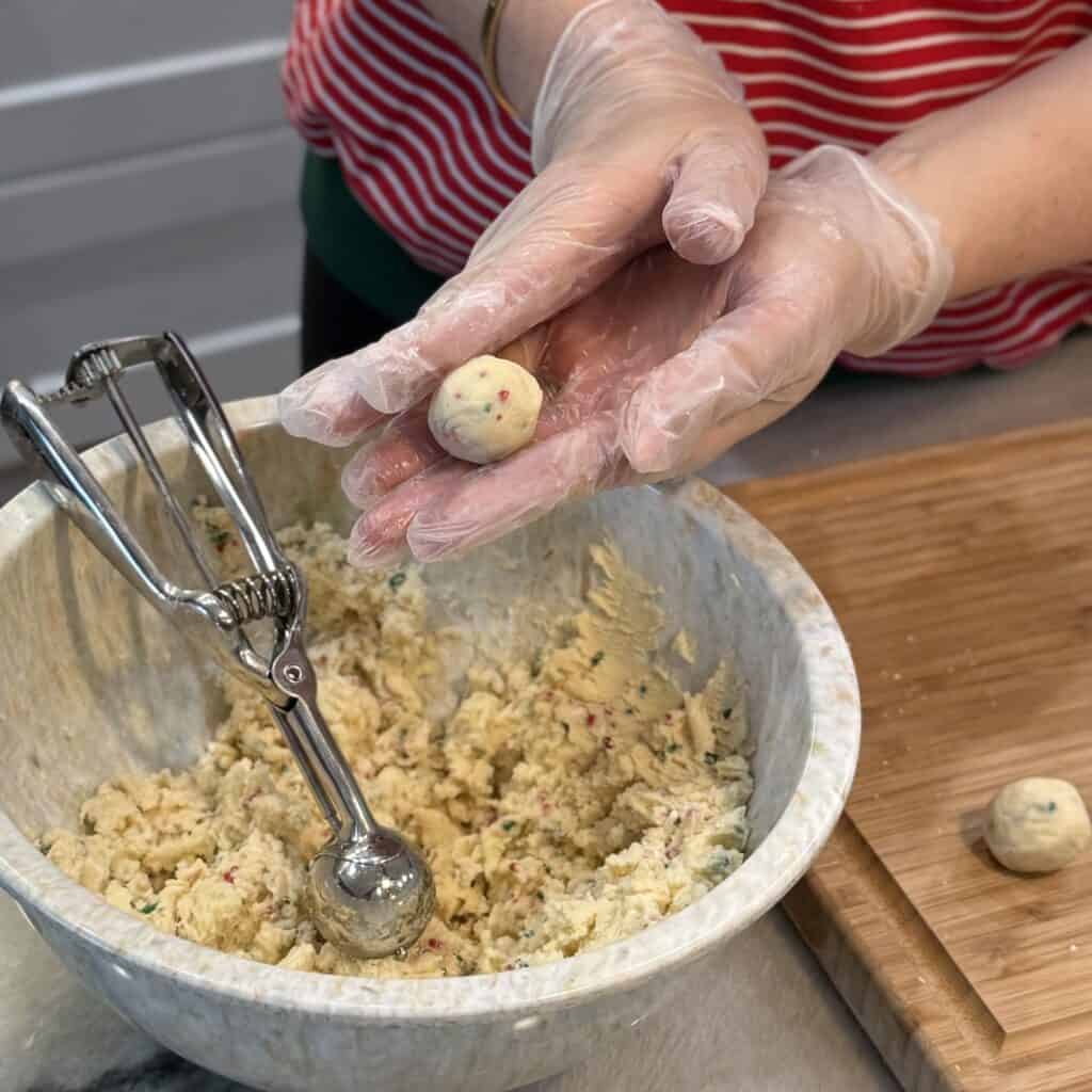 Rolling the dough into balls.