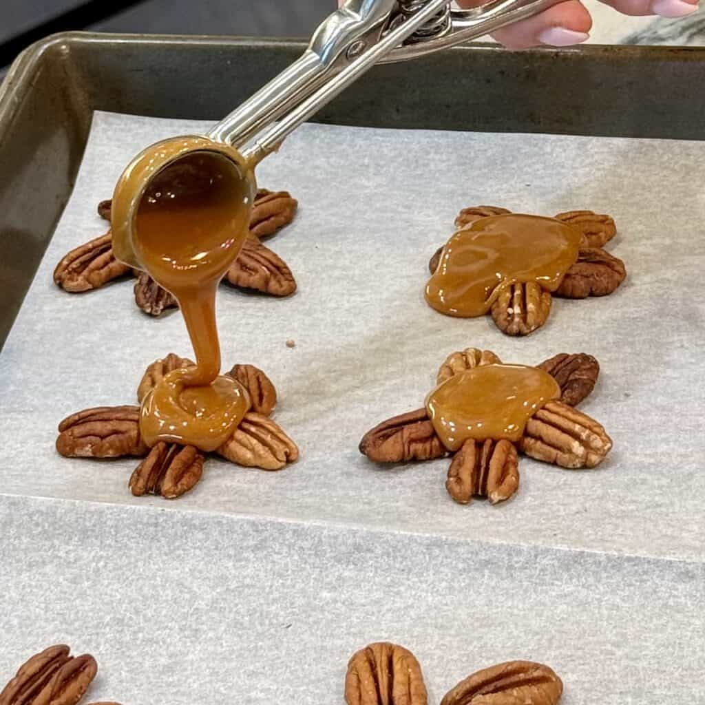 Adding Carmel to pecans.