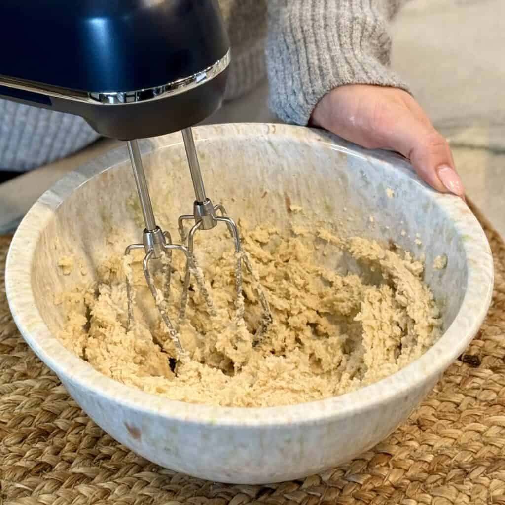 Mixing in all the ingredients.