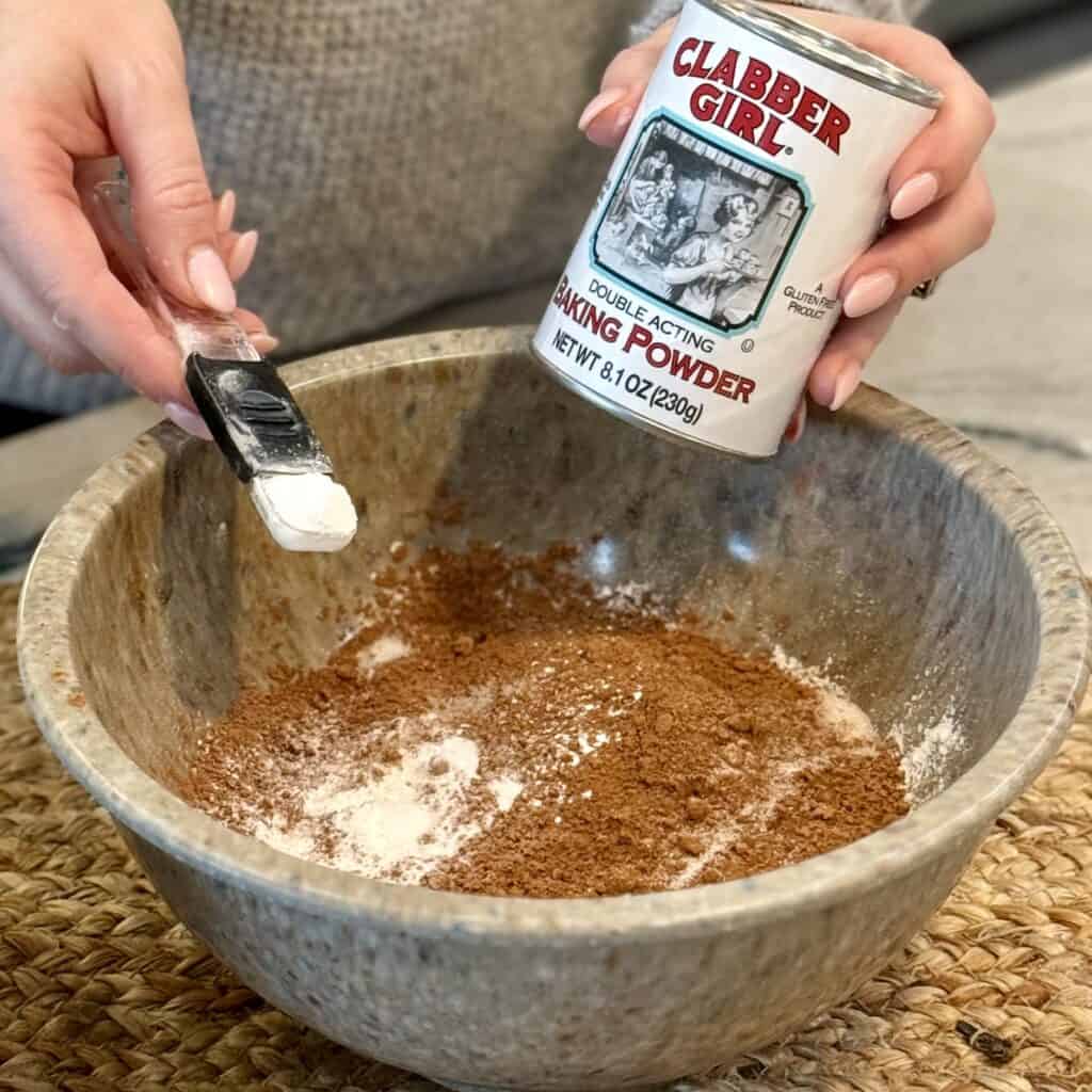 Adding baking powder into the bowl.