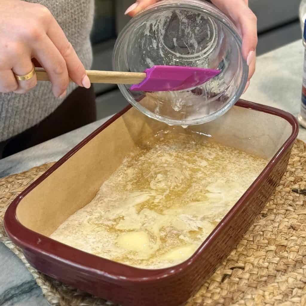 Adding melted butter to the pan.