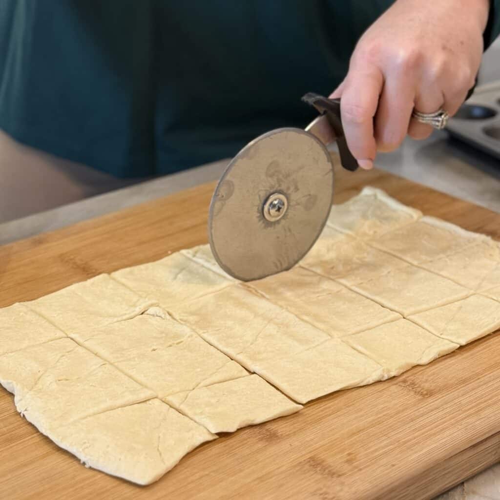Cutting the dough into squares.