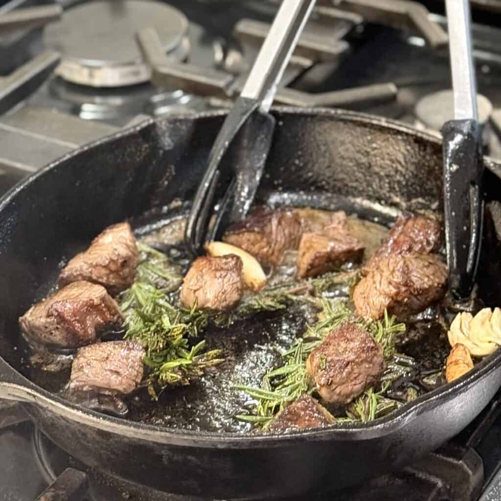 Frying all the ingredients together.