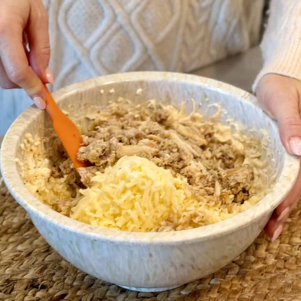 Mixing in the ingredients.