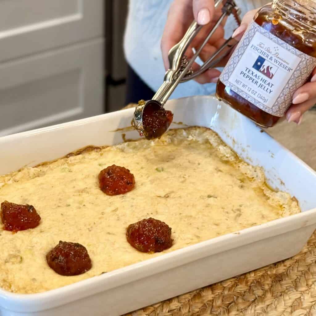 Adding jam to the cheese base.