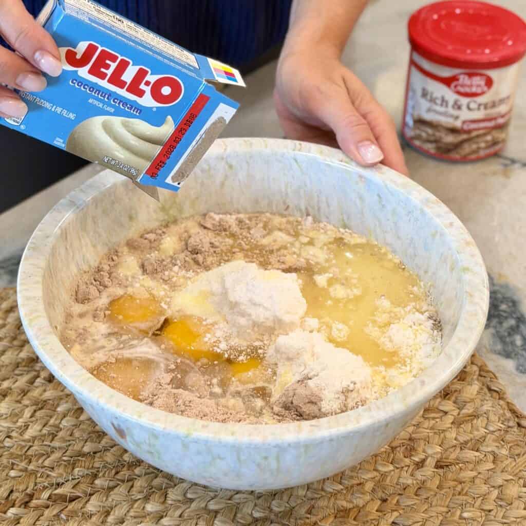 Adding coconut pudding to the bowl.
