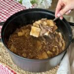 A pot of beef and dumplings.