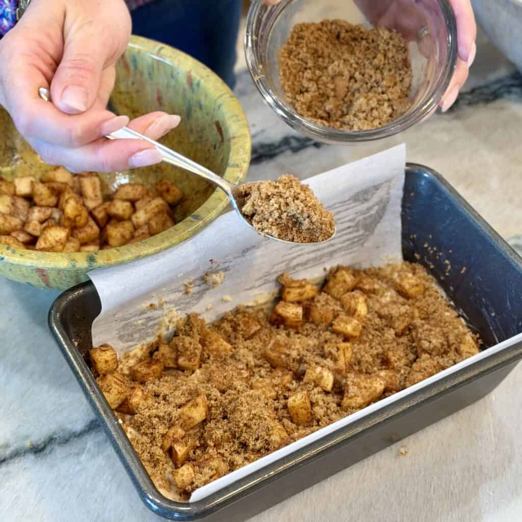 Adding brown sugar to the pan.