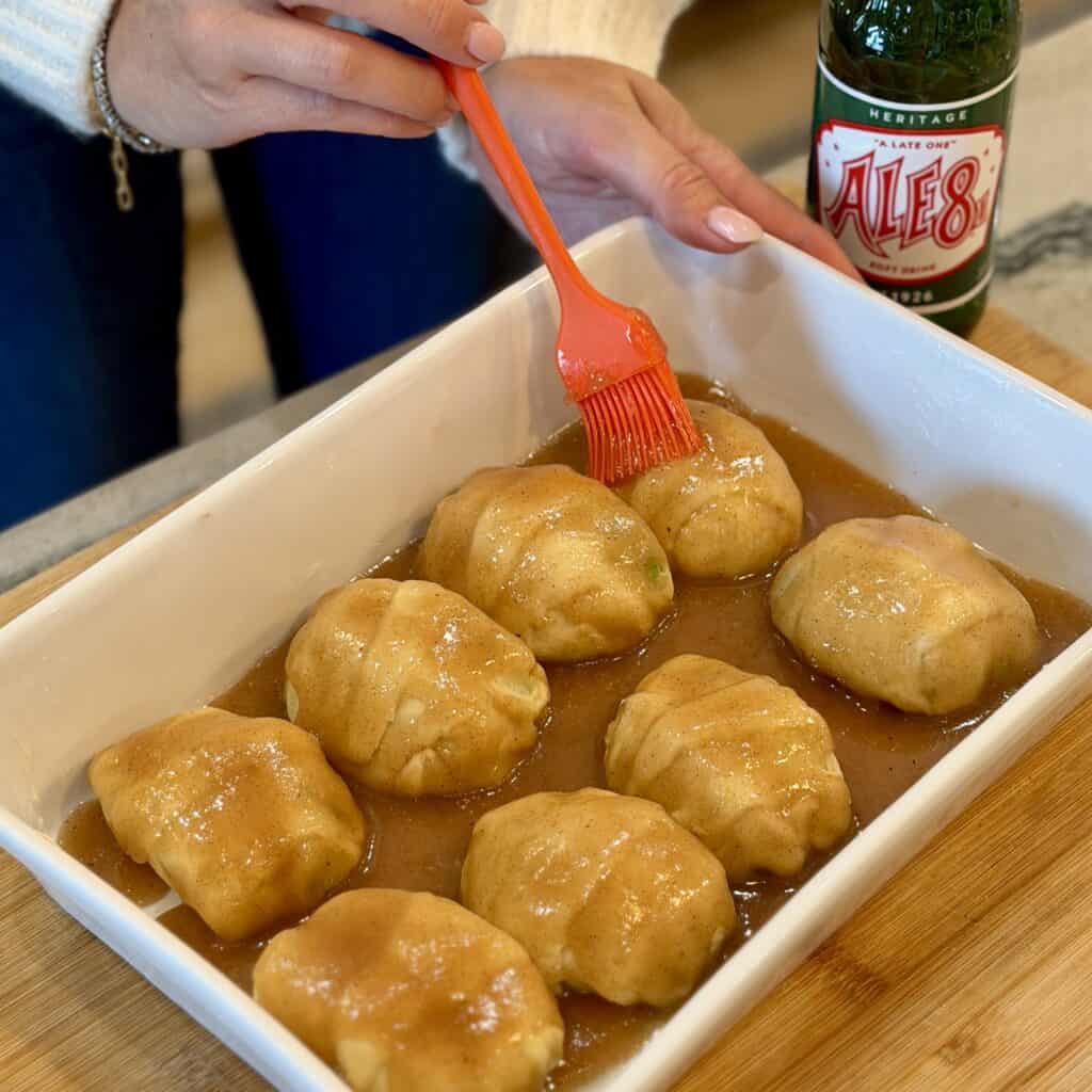Coating the dumplings with sauce.