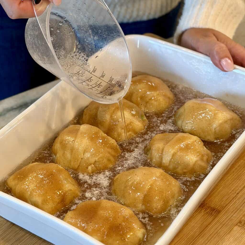 Adding water to the pan.
