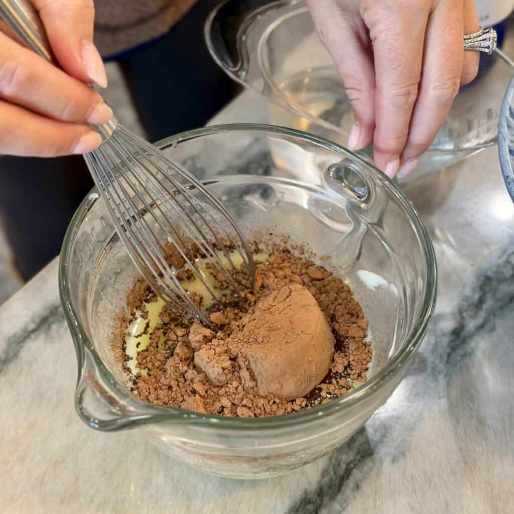 Mixing the ingredients for texas sheet cake batter.