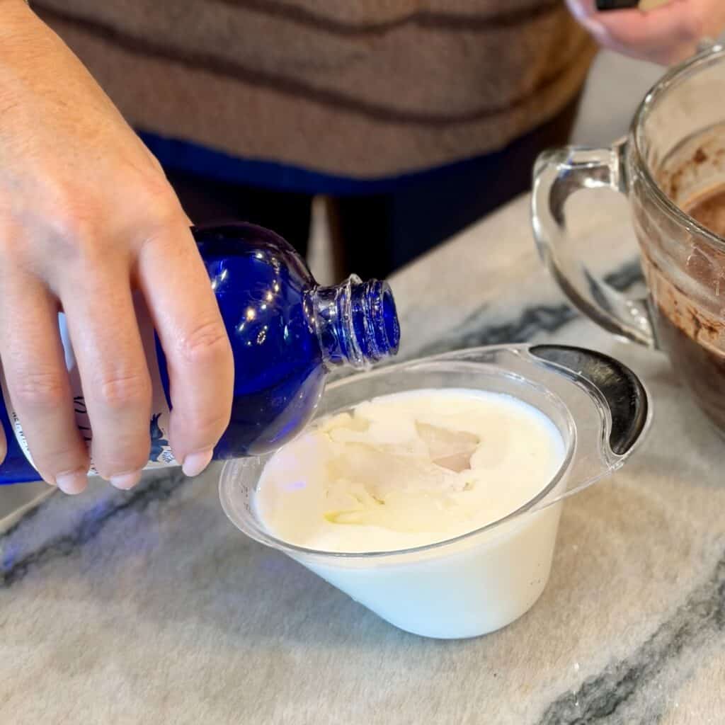 Mixing the ingredients for texas sheet cake batter.